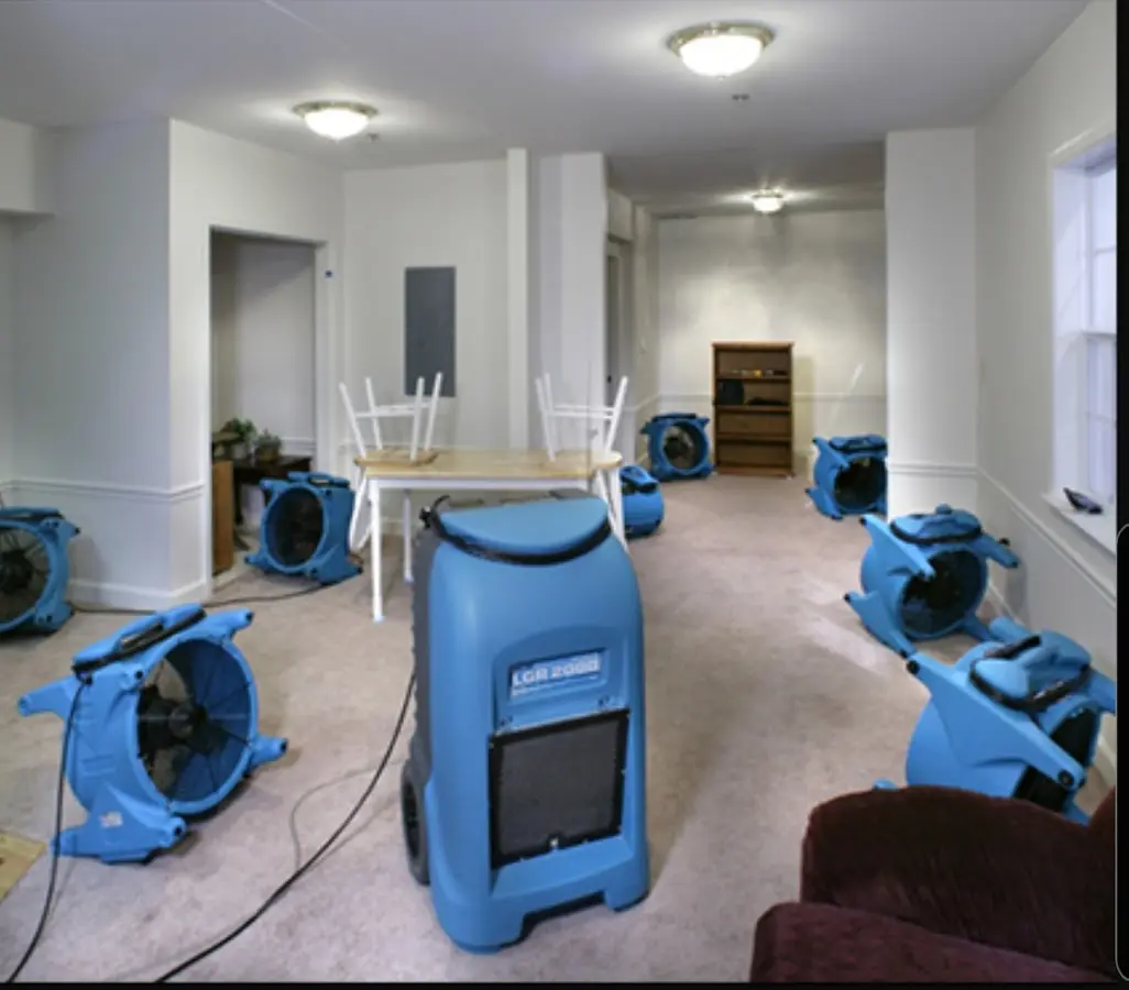 Air movers and dehumidifier setup for Water Damage Restoration in Marinette