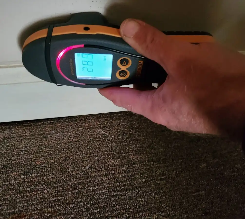 Moisture detection at baseboard during Storm Damage Restoration in Marinette